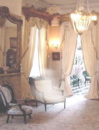 delphine Lalauries ghost in a chair insde the Lalaurie House , photo from Gilbert Murray.